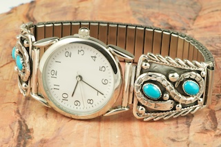 Genuine Sleeping Beauty Turquoise set in Sterling Silver Watch Tips. Sterling Silver Snake Design. Mens Watch with expandable band. Created by Navajo Artist Thomas Chischilly. Signed.